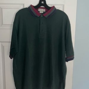GREEN SHORT SLEEVE POLO WITH RED, GREEN, AND PURPLE STRIPES ON SLEEVES & COLLAR